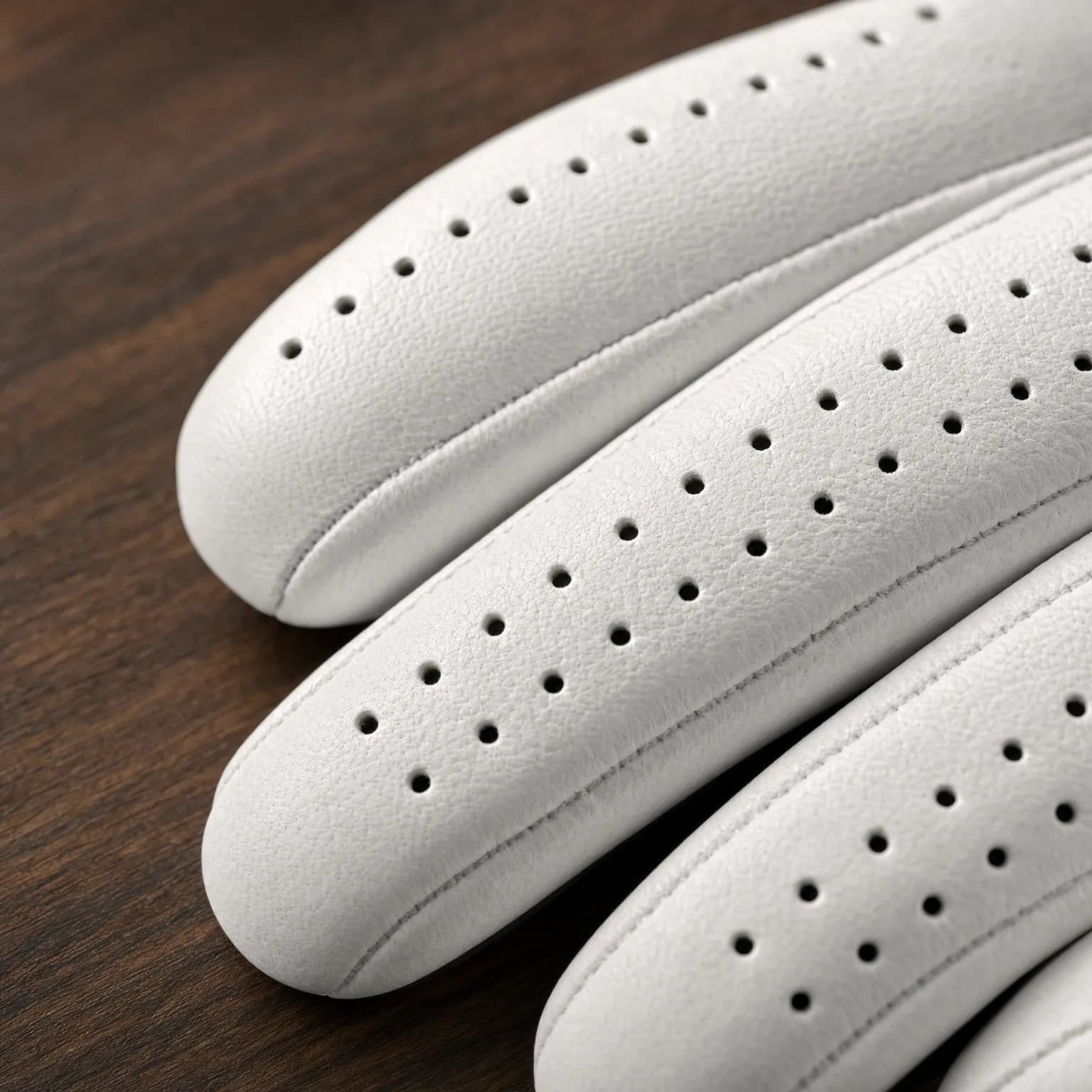 Double rows of ventilation perforations on every finger