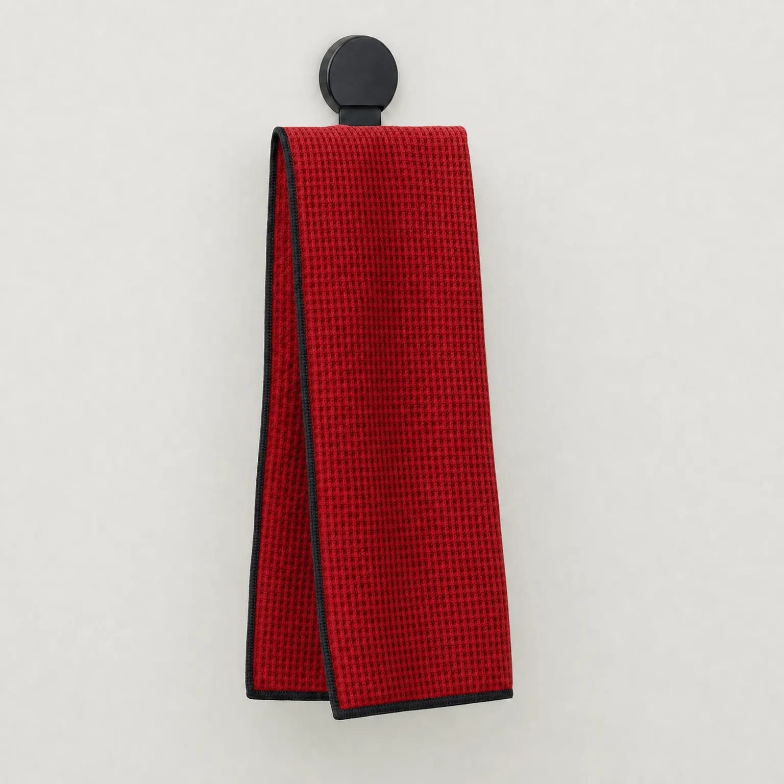 Red waffle-weave golf towel with magnetic clip